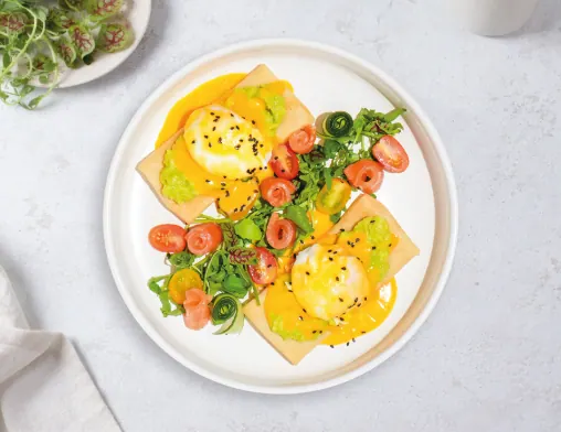 Poached Egg Crepes With Avocado & Salmon at LOOP Café Pererenan